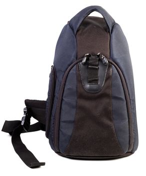 Used black and blue fabric camera bag isolated on white background.
