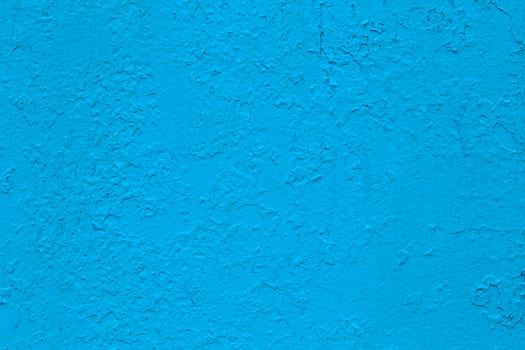 new layer of glossy blue oil paint flat surface texture over peeled old layer