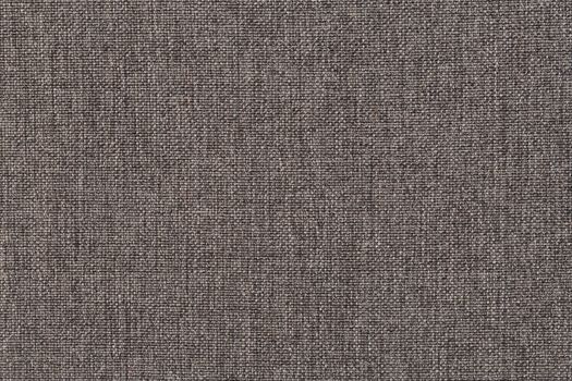 Structure of the ginger cloth with natural texture. Cloth backdrop. The texture of gray fabric textile upholstery of furniture.