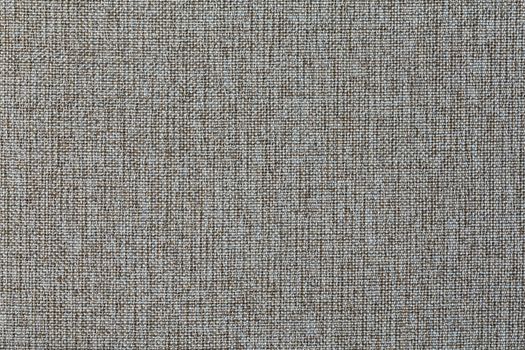 Structure of the ginger cloth with natural texture. Cloth backdrop. The texture of gray fabric textile upholstery of furniture.