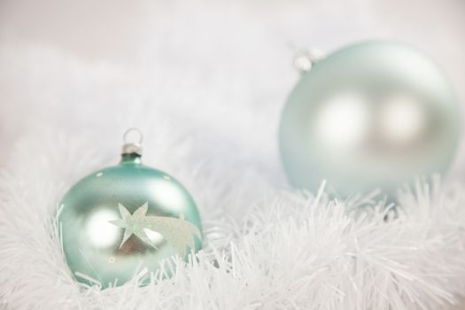 Silver and blue baubles Christmas decoration in white fluffy background