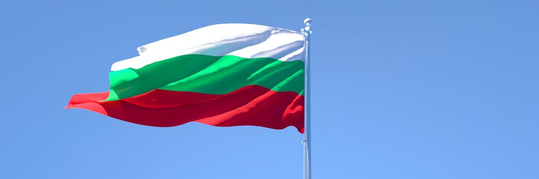 3D rendering of the national flag of Bulgaria waving in the wind against a blue sky.