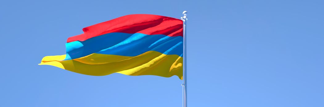 3D rendering of the national flag of Armenia waving in the wind against a blue sky.