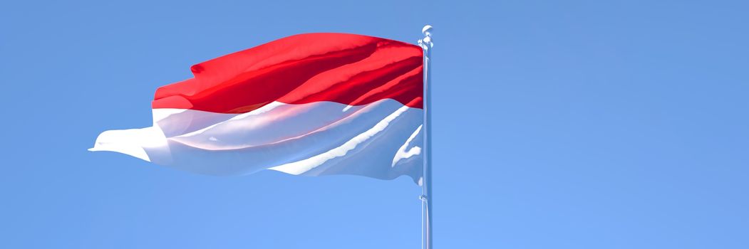 3D rendering of the national flag of Indonesia waving in the wind against a blue sky