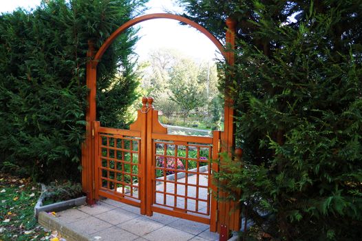 decorative wooden gate in the garden close up