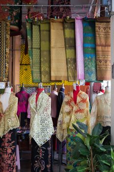 Fabrics stall Pha Soet Hot Spring Chiang Rai Thailand with clothes and material. High quality photo