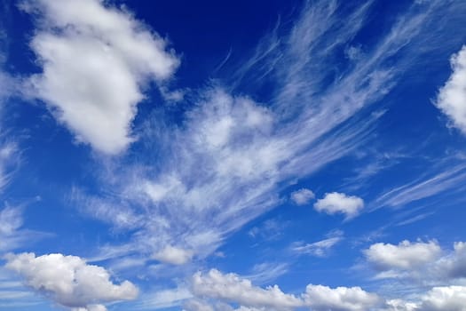 View from below. Blue sky with white clouds.