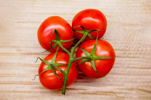 Juicy and delicious vegetables on a wooden background.