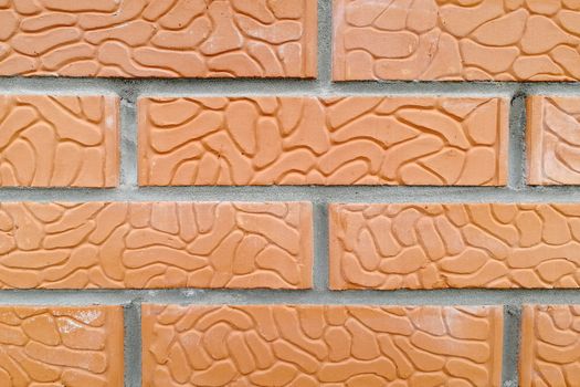 Orange and textured stone. Front view