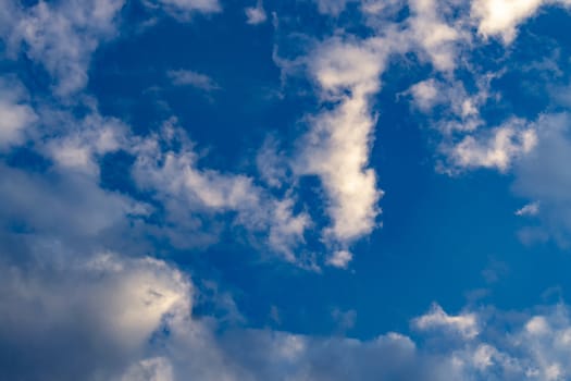 View from below. Blue sky with white clouds.