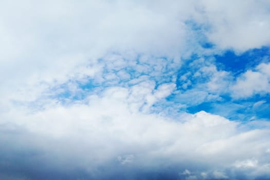 View from below. Blue sky with white clouds.