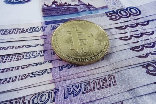 Russian paper money and bitcoin.
