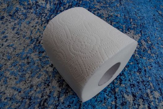 A roll of toilet paper on a blue background