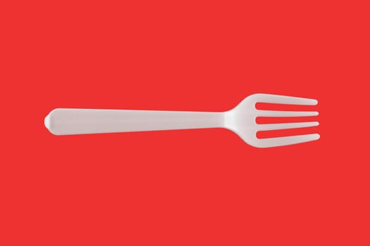 One plastic white fork on a red background