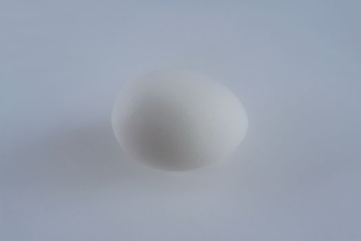 Egg white on a gray background. Natural shape