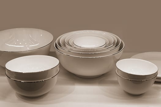 A set of white utensils. Front view