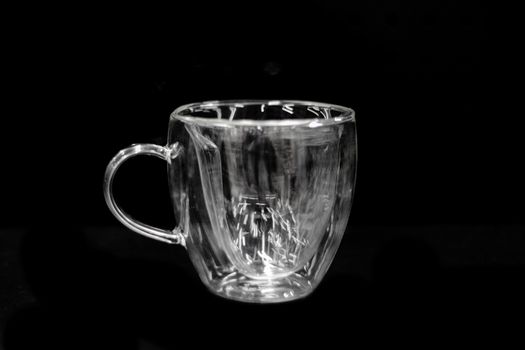 Transparent glass tea mug. Front view.