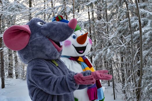 Animators in textile mouse and snowman costume.