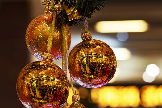 New Year's balls are golden. Indoors. View from the front. Surgut city.