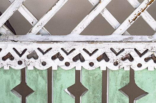 Fragment of the ornament of the veranda of an old wooden house.