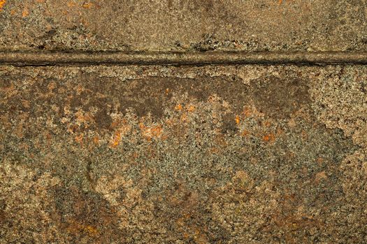 Fragment of a striking metal sheet with a weld. Textural background.