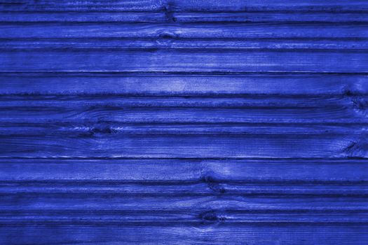 Blue wooden textured background. View from the front. Pantone 2020.