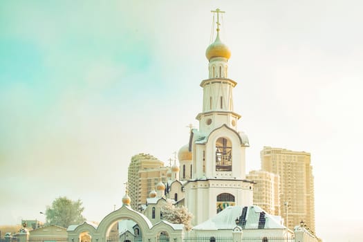 Orthodox church with a bell tower in the foreground. View from the front.
