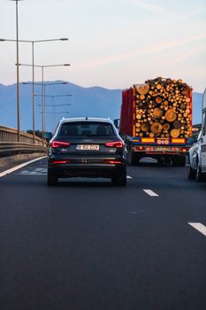 Traveling cars in motion on asphalt road, back view of car on street. Bucharest, Romania, 2020