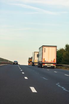 Loaded European truck in motion on asphalt road, transportation and delivery concept. Bucharest, Romania, 2020