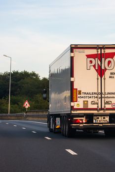 Loaded European truck in motion on asphalt road, transportation and delivery concept. Bucharest, Romania, 2020