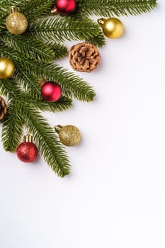 Christmas composition with copy space. Colorful ornament, baubles and fir needles decorations, top view