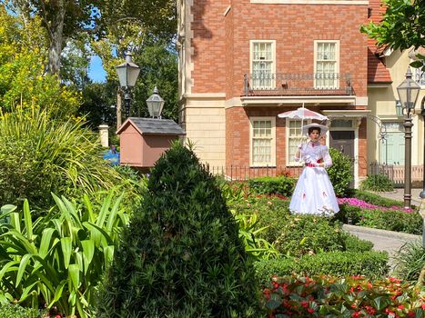 Orlando,FL/USA-10/24/20: Mary Poppins standing in a garden in the England area of the World Showcase in EPCOT at Disney World in Orlando, Florida.