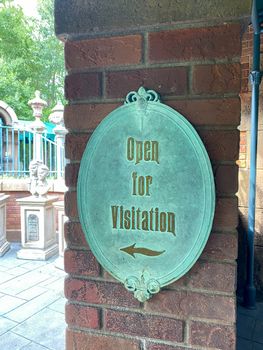 Orlando,FL/USA-10/21/20: The sign that says Open for Visitation outside of the Haunted Mansion ride in the Magic Kingdom at  Walt Disney World Resorts in Orlando, FL.