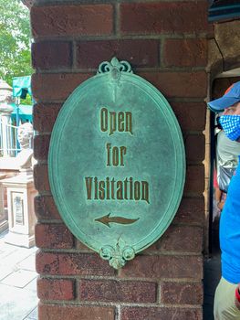 Orlando,FL/USA-10/21/20: The sign that says Open for Visitation outside of the Haunted Mansion ride in the Magic Kingdom at  Walt Disney World Resorts in Orlando, FL.