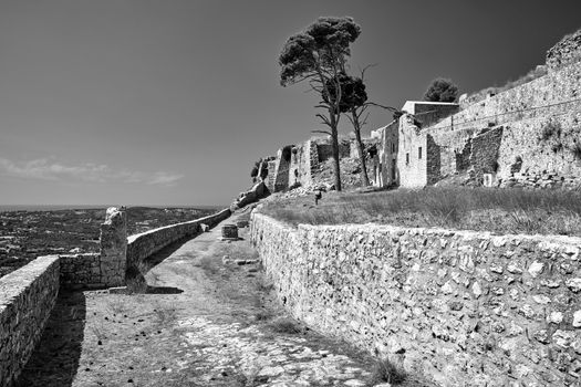 Stone walls of the medieval Venetian castle of St George's on the island of Kefalonia in Greece, monochrome