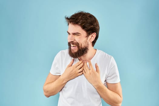 Cheerful man gesturing with his hands emotions cropped view on blue background studio. High quality photo