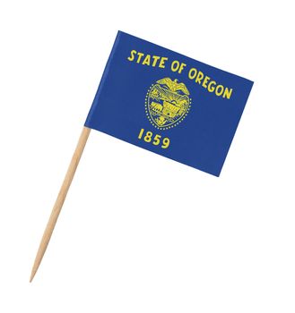 Small paper US-state flag on wooden stick - Oregon - Isolated on white