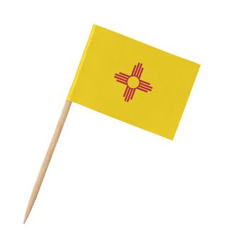 Small paper US-state flag on wooden stick - New Mexico - Isolated on white