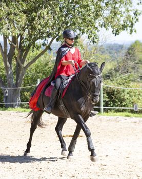  riding girl are training her black horse