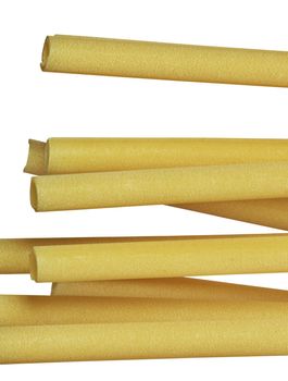 A group of Italian pasta called ziti on a white background ,long empty tube with smooth side ,vertical composition