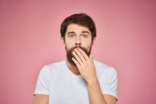 cheerful bearded man white t-shirt emotions cropped view pink background. High quality photo