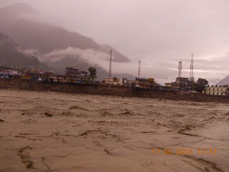 Himalayan tsunami or flood in Ganges India. The Ganges River has been heavily flooded in 2012 and 2013, causing widespread Destruction. High quality photo