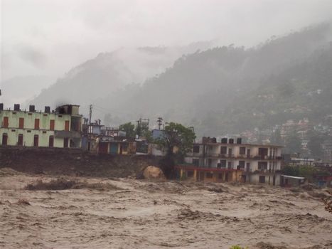 Himalayan tsunami or flood in Ganges India. The Ganges River has been heavily flooded in 2012 and 2013, causing widespread Destruction. High quality photo