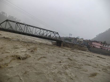 Disaster flood in river Ganges India. The Ganges River has been heavily flooded in 2012 and 2013, causing widespread Destruction. High quality photo