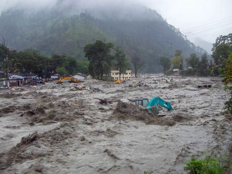 Himalayan tsunami or flood in Ganges India. The Ganges River has been heavily flooded in 2012 and 2013, causing widespread Destruction. . High quality photo