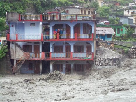 Himalayan tsunami or flood in Ganges India. The Ganges River has been heavily flooded in 2012 and 2013, causing widespread Destruction. High quality photo