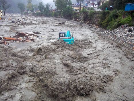 Himalayan tsunami or flood in Ganges India. The Ganges River has been heavily flooded in 2012 and 2013, causing widespread Destruction. High quality photo