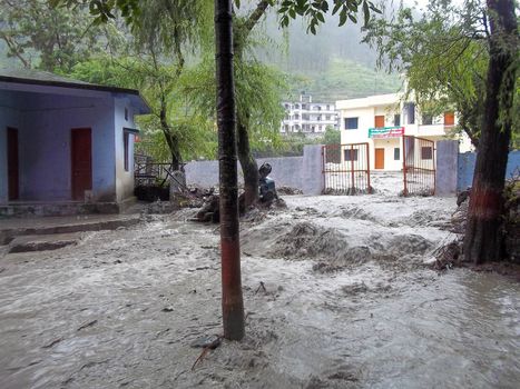 Himalayan tsunami or flood in Ganges India. The Ganges River has been heavily flooded in 2012 and 2013, causing widespread Destruction. High quality photo