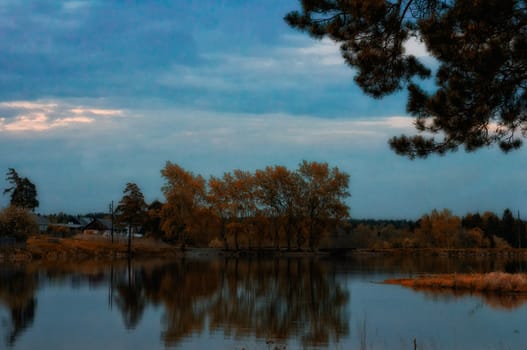 Beautiful blue sky over the lake and coniferous forest.