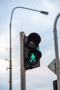 A green traffic light in the city center.